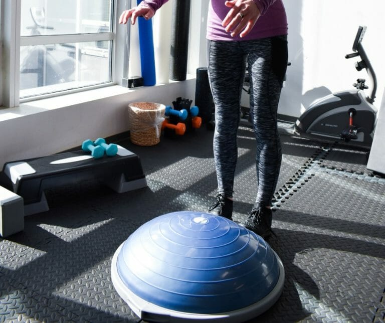 Runner doing stretches to prevent running injuries in Vancouver